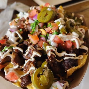 Nacho Bizness signature dishes Notorious B.I.G.Loaded NachosThe Macarrito